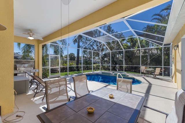 pool featuring area for grilling, a ceiling fan, glass enclosure, outdoor dining area, and a patio area