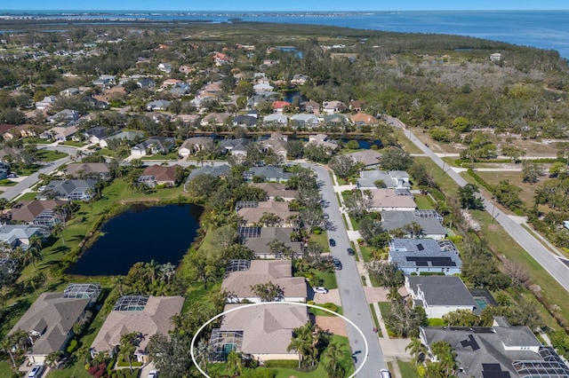 bird's eye view with a residential view and a water view