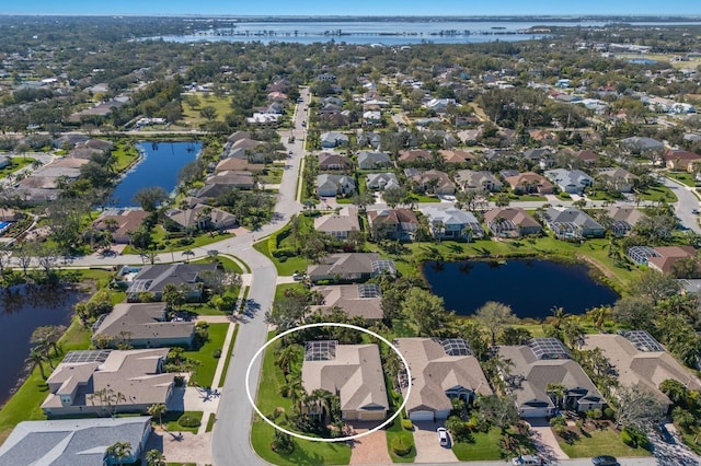 aerial view featuring a residential view and a water view