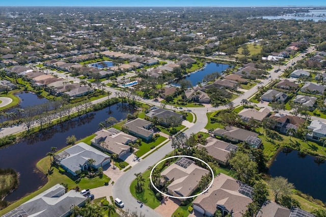 bird's eye view with a residential view and a water view