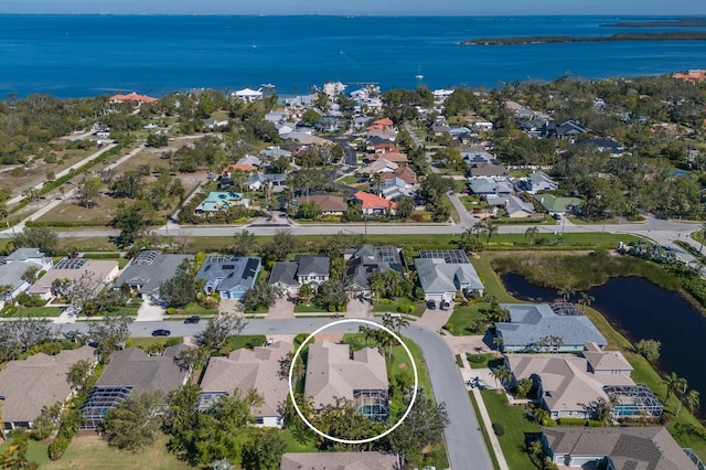 aerial view with a residential view and a water view