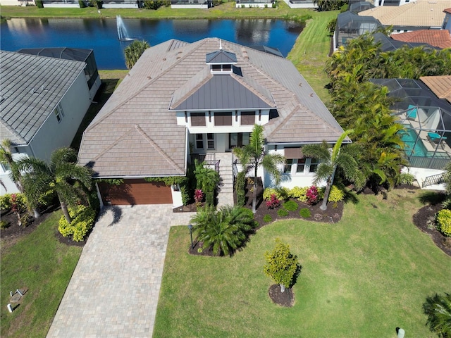 birds eye view of property with a water view