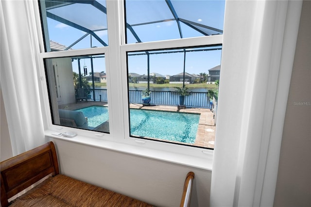 view of swimming pool with a water view