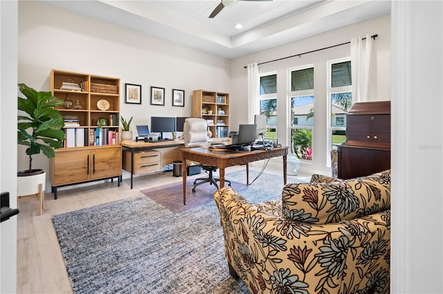 office with recessed lighting, a raised ceiling, and ceiling fan