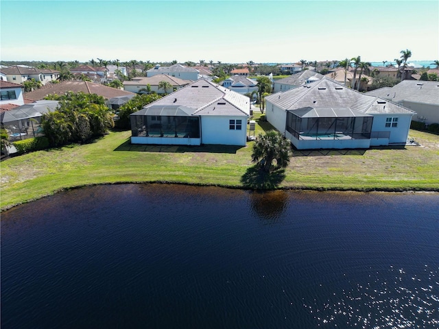 birds eye view of property with a residential view and a water view