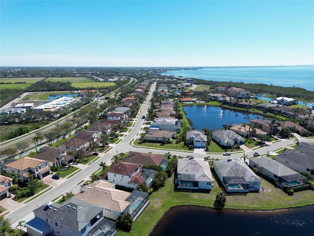 aerial view with a residential view and a water view