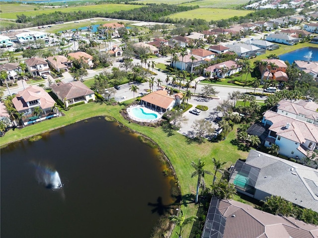 bird's eye view featuring a residential view and a water view