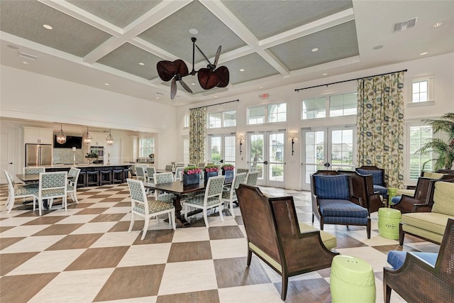5 Barbados Rd Unit 31, Englewood, FL 34223 - dining space with a high ceiling, ceiling fan, coffered ceiling, beam ceiling, and recessed lighting