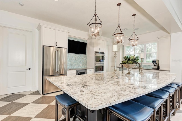 5 Barbados Rd Unit 31, Englewood, FL 34223 - kitchen featuring stainless steel appliances, a chandelier, a kitchen breakfast bar, white cabinets, and recessed lighting