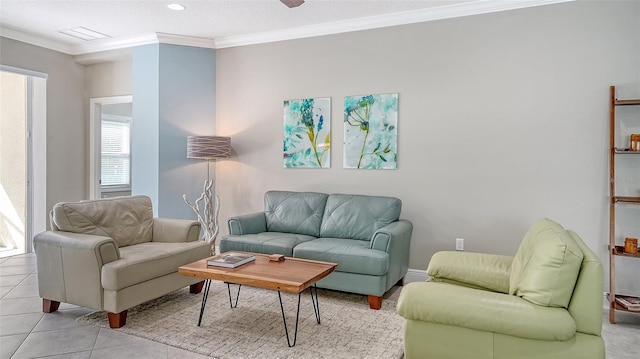 living room featuring light tile patterned floors, visible vents, and ornamental molding