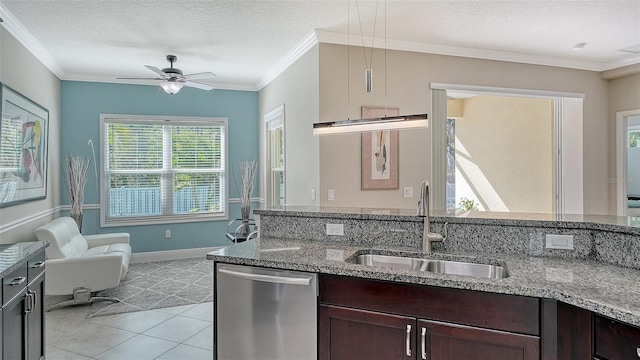 kitchen featuring a sink, a textured ceiling, dishwasher, and crown molding