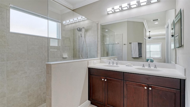 bathroom with a sink, double vanity, walk in shower, and ornamental molding