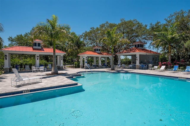 pool featuring a gazebo and a patio