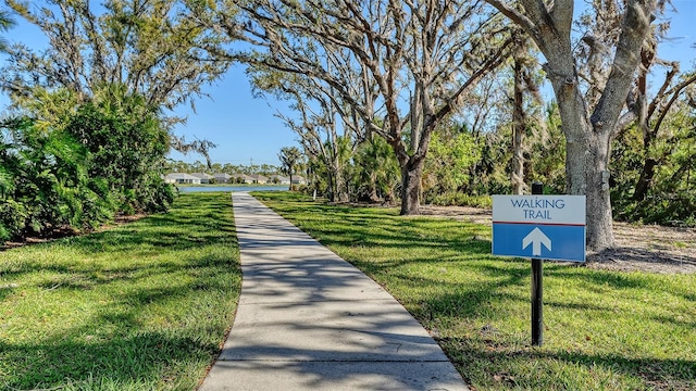 view of property's community with a lawn