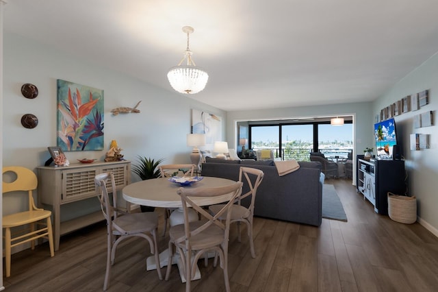 dining area featuring baseboards and wood finished floors