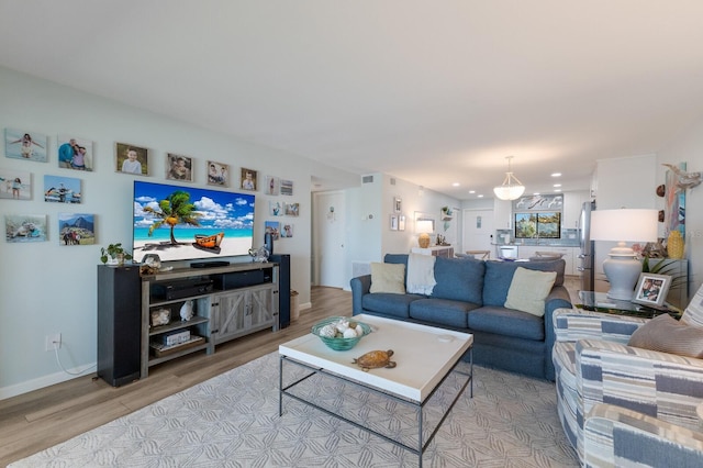 living room with light wood-style floors and baseboards