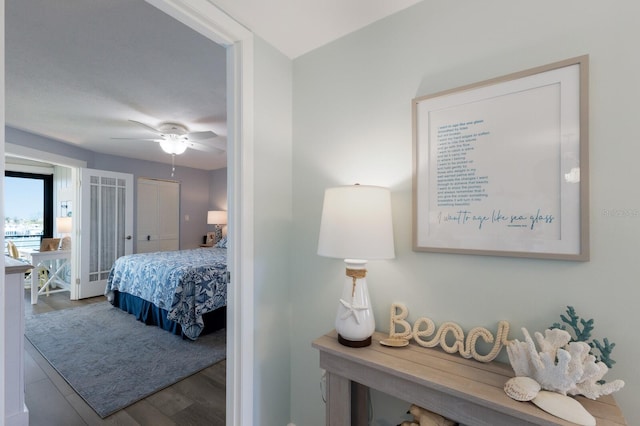 bedroom with wood finished floors and a ceiling fan