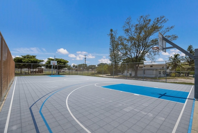 view of basketball court featuring community basketball court and fence