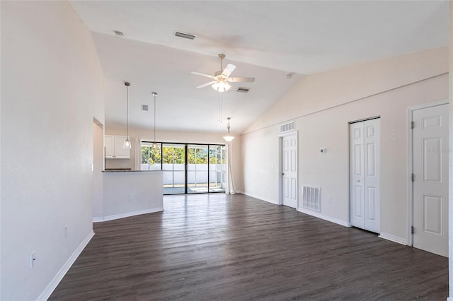 4659 Alligator Dr, Venice, FL 34293 - unfurnished living room with lofted ceiling, dark wood-style floors, a ceiling fan, and visible vents