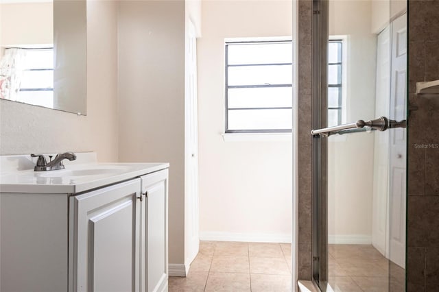 4659 Alligator Dr, Venice, FL 34293 - full bath with a shower with door, baseboards, vanity, and tile patterned flooring
