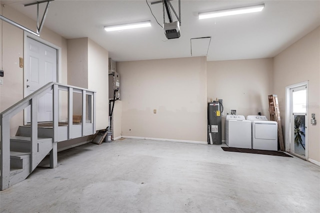 4659 Alligator Dr, Venice, FL 34293 - garage featuring washer and dryer, a garage door opener, water heater, and baseboards