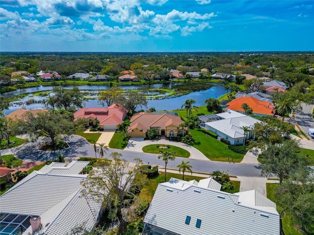 bird's eye view featuring a residential view and a water view