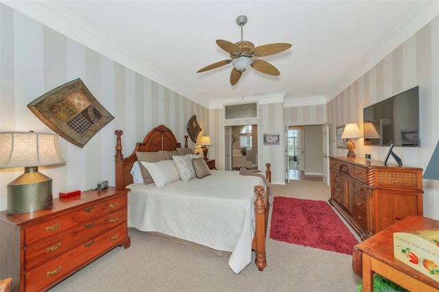 bedroom featuring wallpapered walls, baseboards, ceiling fan, ornamental molding, and light carpet