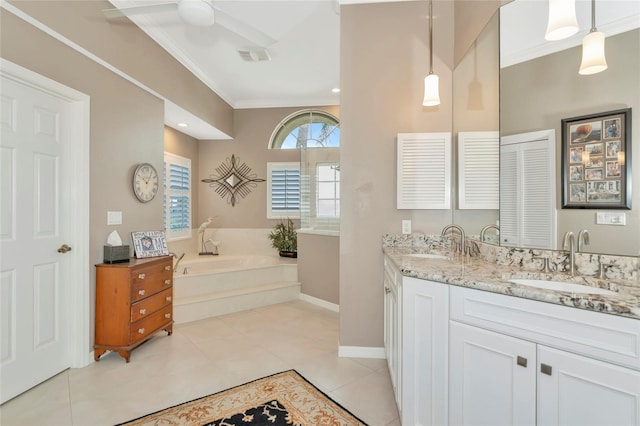 bathroom with tile patterned floors, ornamental molding, a garden tub, and a sink