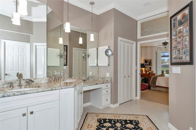 full bathroom featuring tile patterned flooring, crown molding, ceiling fan, and a sink