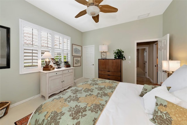 bedroom with visible vents, a ceiling fan, and baseboards