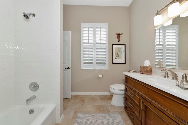 full bath featuring toilet, vanity, shower / tub combination, and baseboards