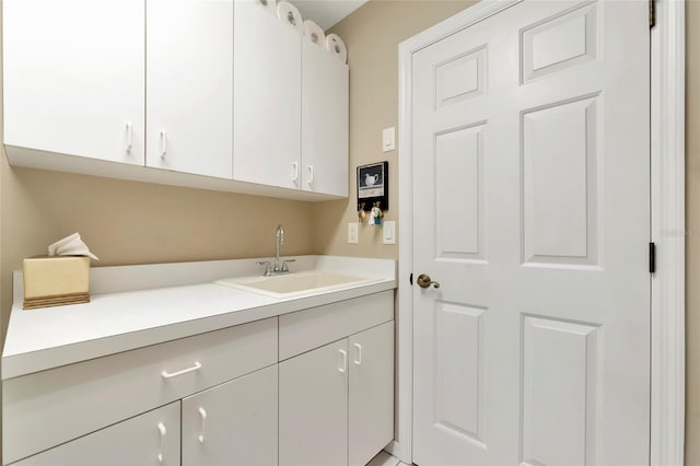 laundry area with a sink