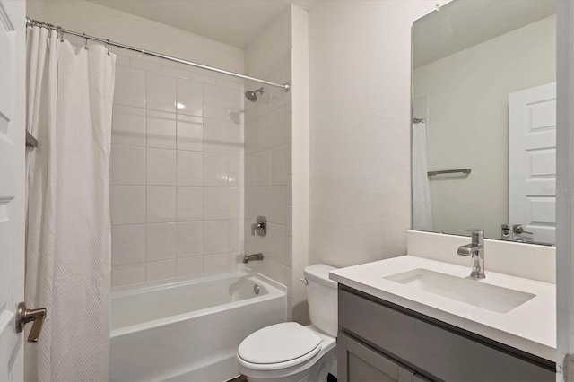 bathroom with shower / bath combo with shower curtain, toilet, and vanity