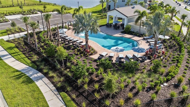pool with a yard, a patio area, and a fenced backyard