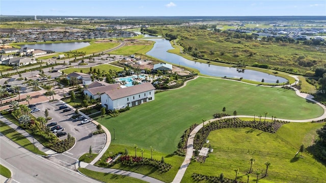 bird's eye view with a residential view and a water view