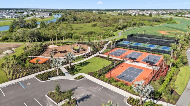 birds eye view of property with a water view
