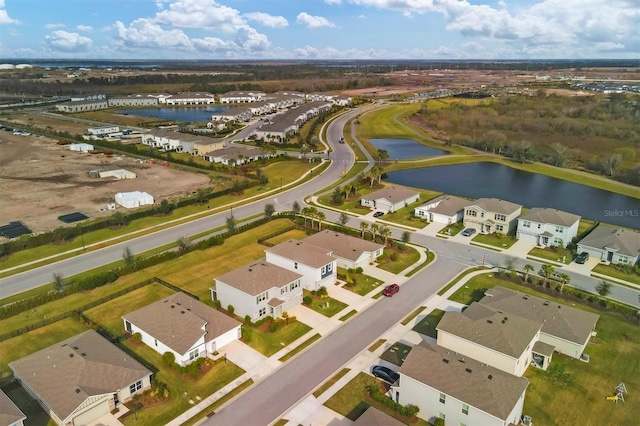 birds eye view of property with a residential view and a water view