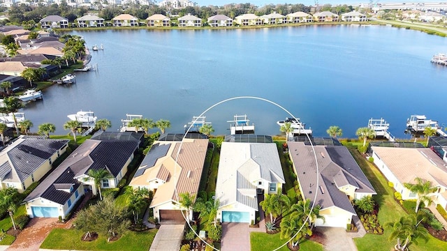 bird's eye view featuring a residential view and a water view