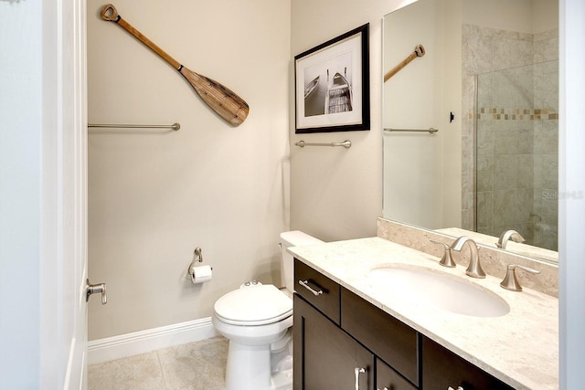 full bathroom featuring baseboards, toilet, vanity, and tile patterned flooring