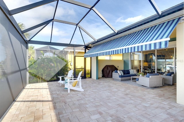 view of patio with an outdoor living space, a grill, and a lanai