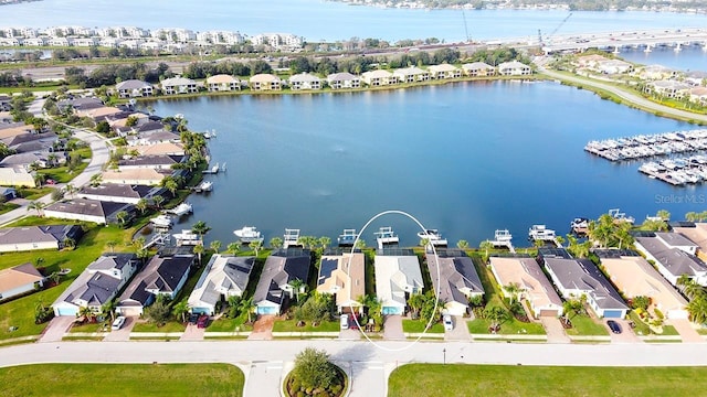 bird's eye view featuring a residential view and a water view