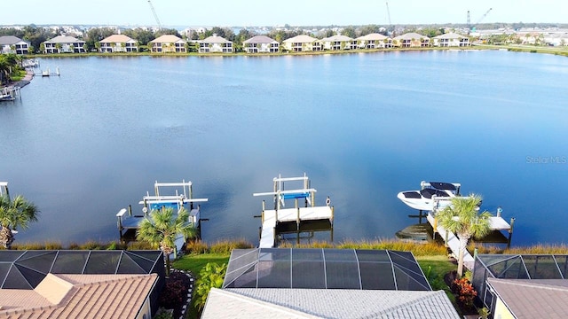 aerial view with a water view and a residential view