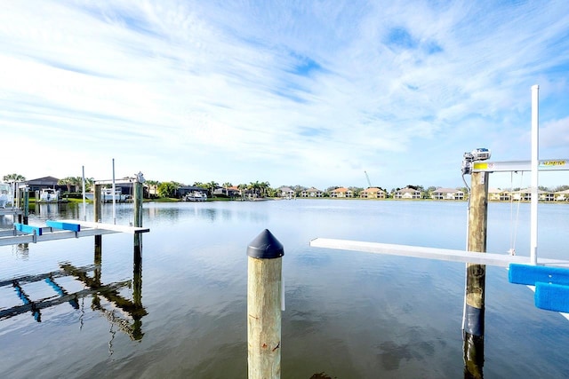 dock area with a water view