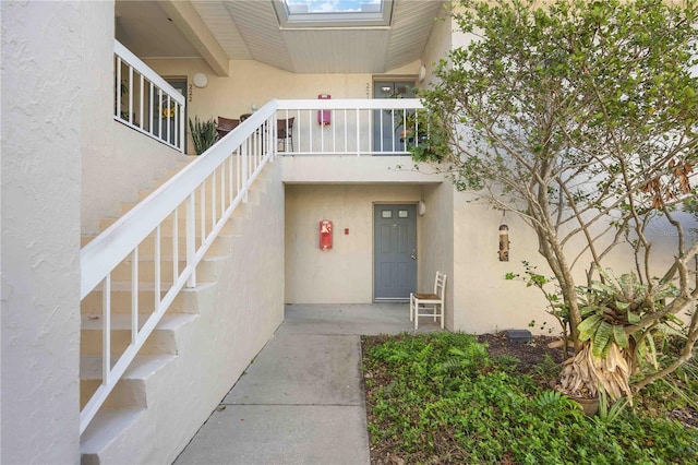 property entrance featuring stucco siding