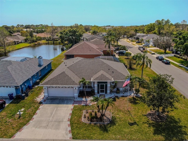 aerial view featuring a residential view and a water view