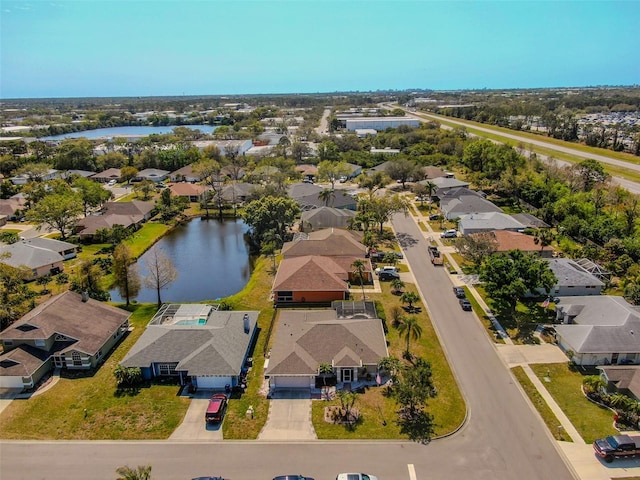 bird's eye view with a residential view and a water view