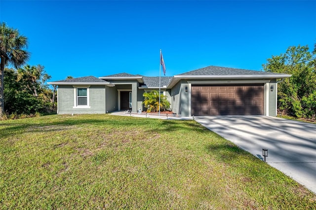 view of front of house featuring a front lawn, a garage, driveway, and stucco siding