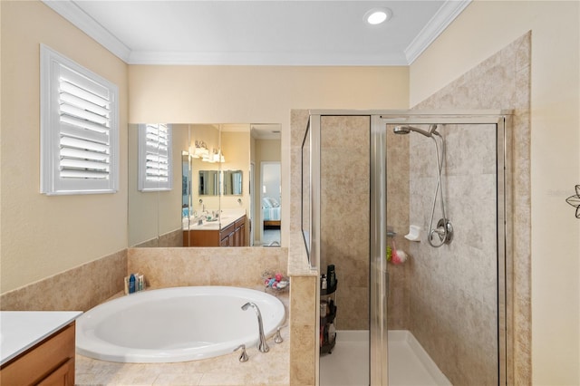 bathroom featuring vanity, a shower stall, and crown molding