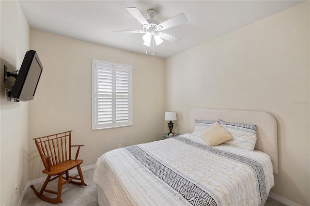 bedroom with carpet flooring, a ceiling fan, and baseboards