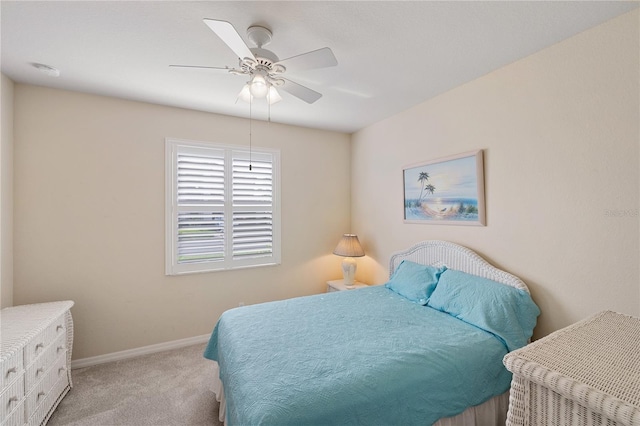 bedroom with baseboards, carpet, and a ceiling fan